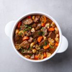 beef-bourguignon-stew-with-vegetables-grey-backgro-9MS5XPZ