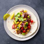 taco-with-meat-and-vegetables-dark-background-clos-J25EB7V